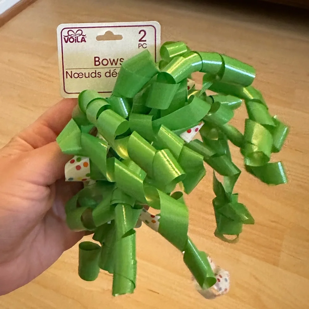 One large curled ribbon sticky bow
